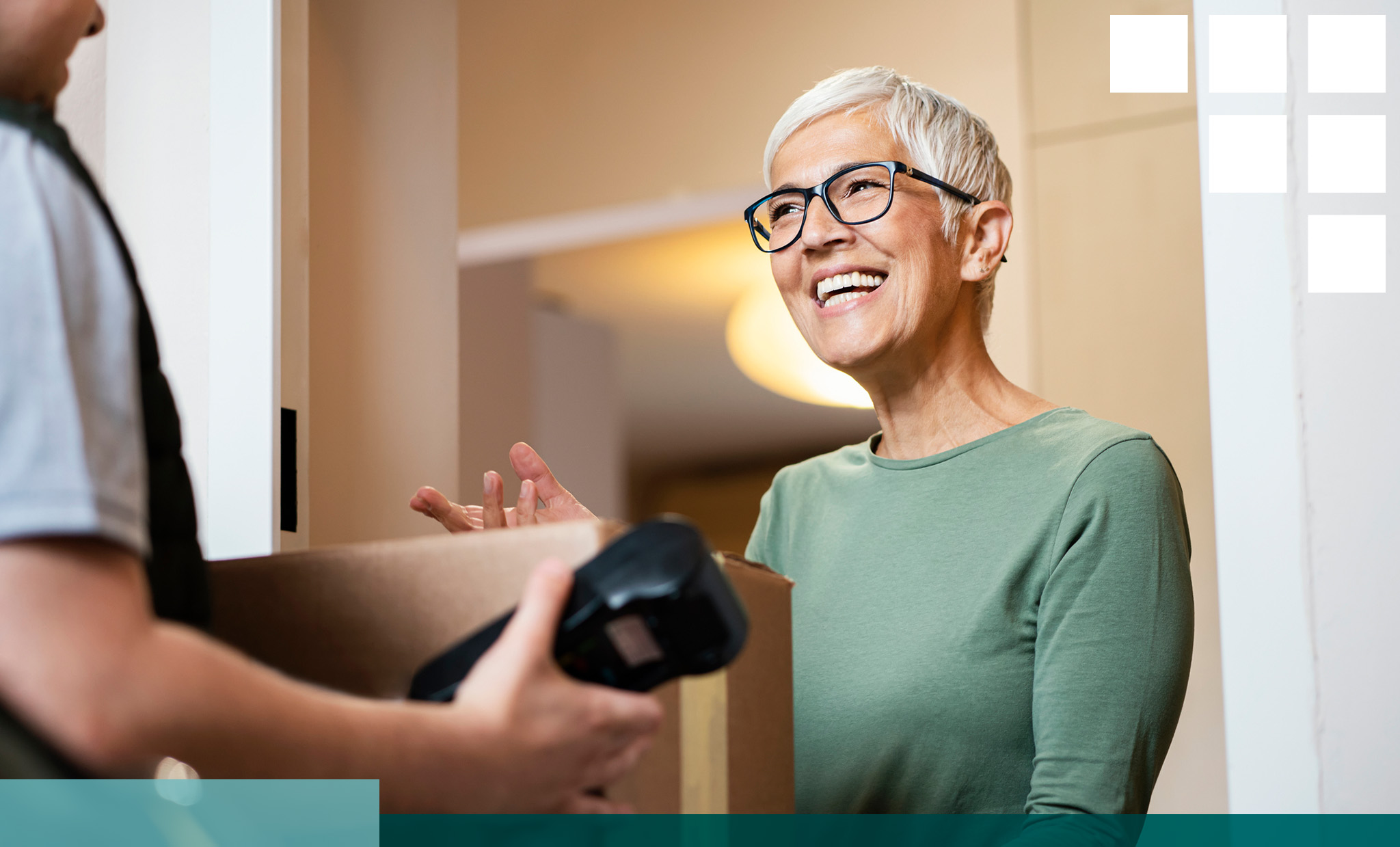 Smiling woman receiving a package from a delivery person in a casual indoor setting, representing a positive customer experience.