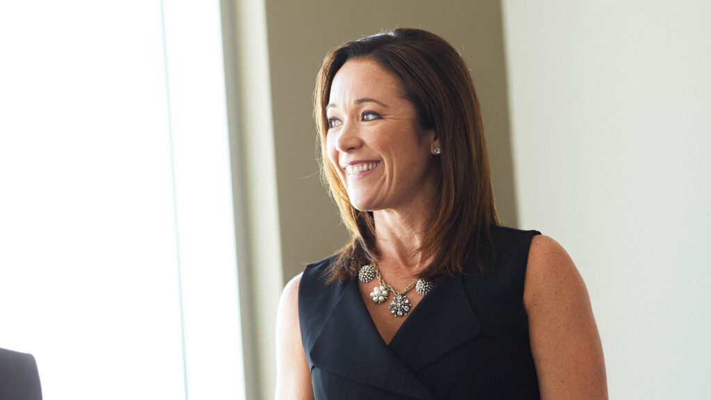 Close-up of woman smiling in office
