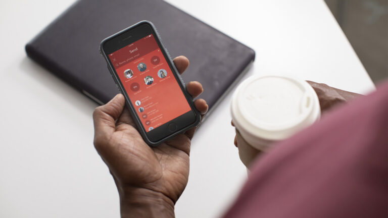 Close-up of smartphone sending a payment