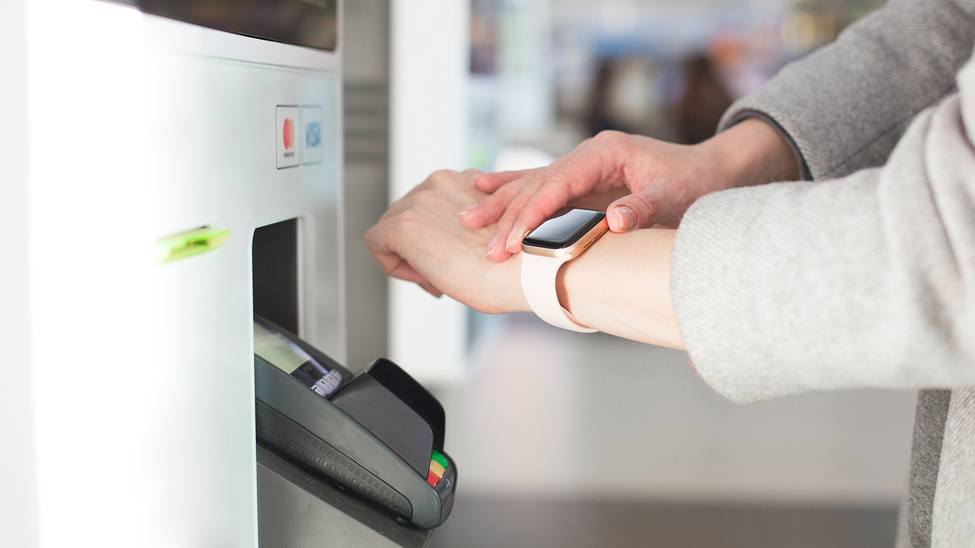 Close-up of smartwatch making payment at terminal