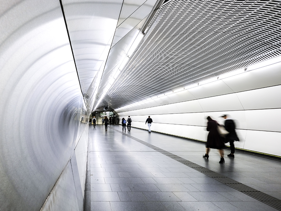 People walking through an underpass