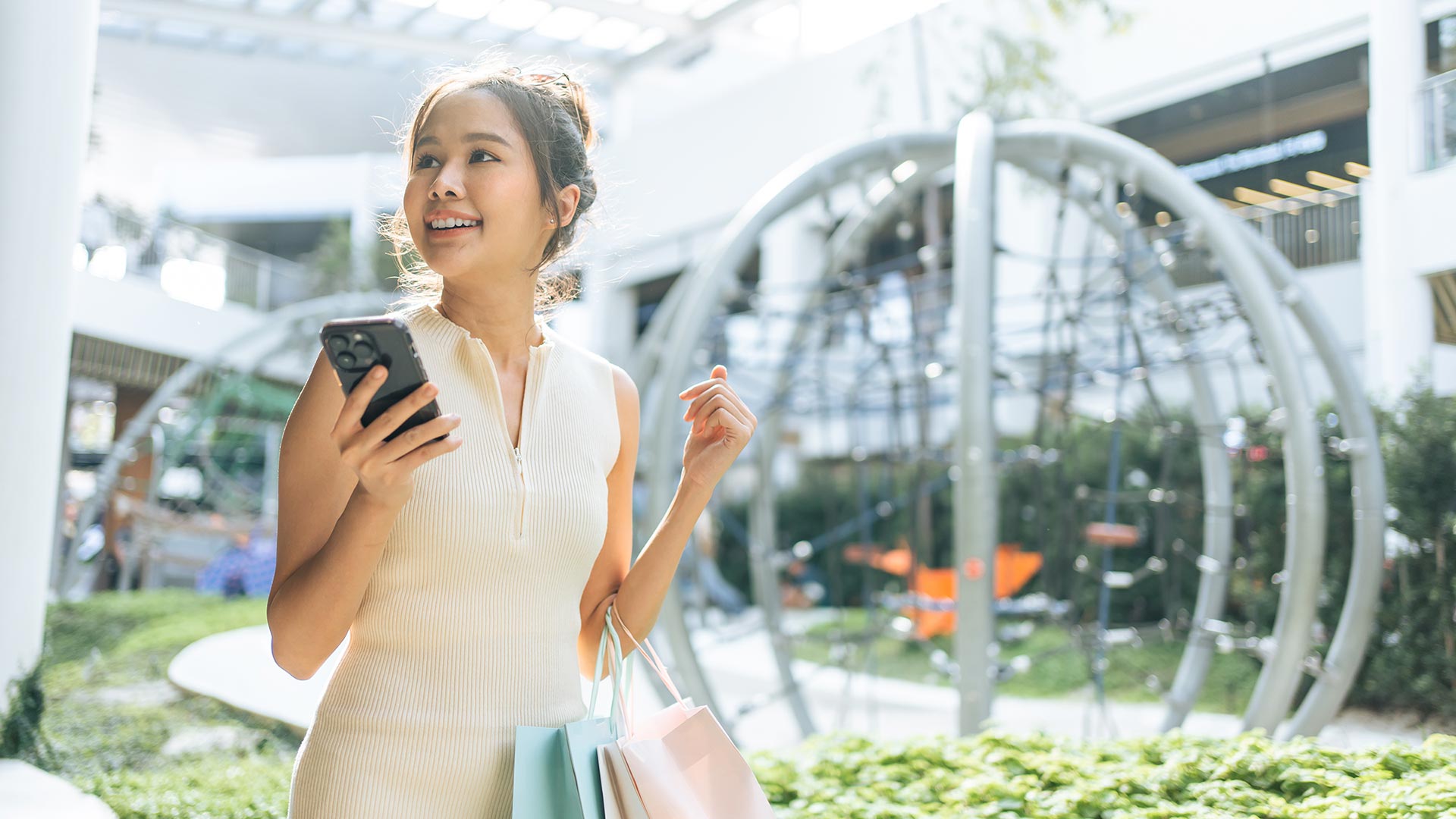 Beautiful woman shopping and using phone