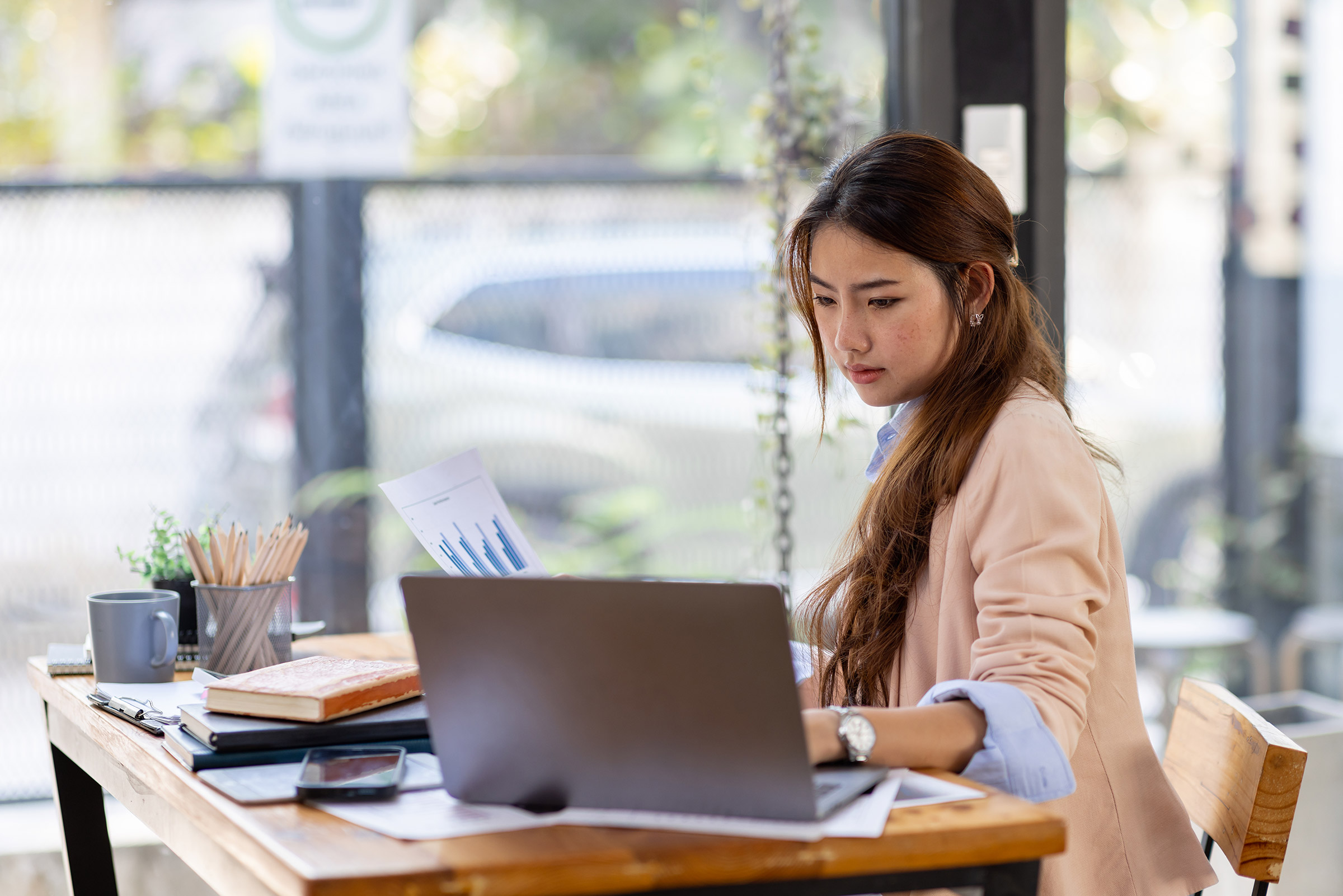 Asian business woman working inside an office.