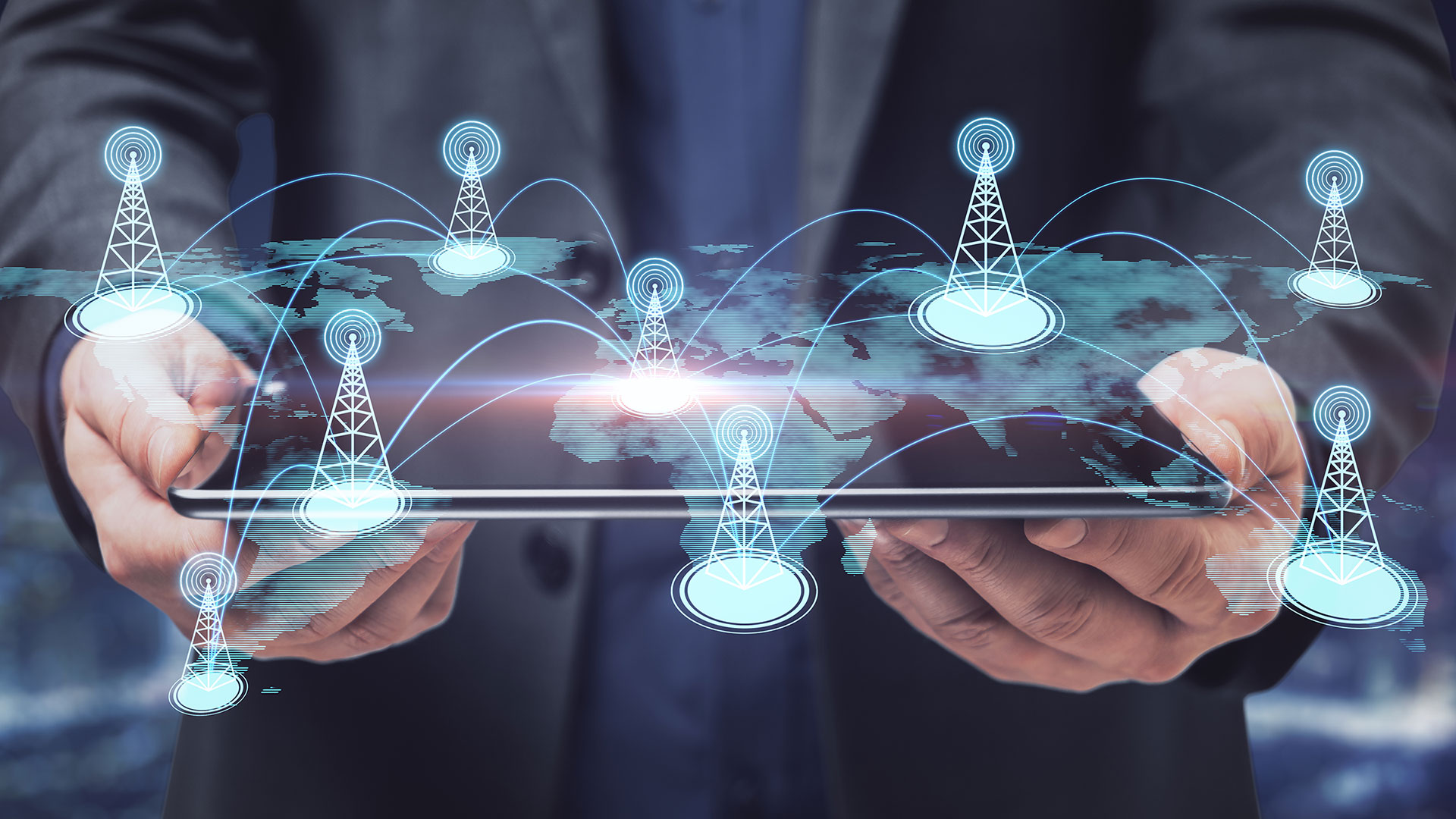 Businessman Hand Holding Tablet With Creative Glowing Digital Map With Location Pins On Blurry