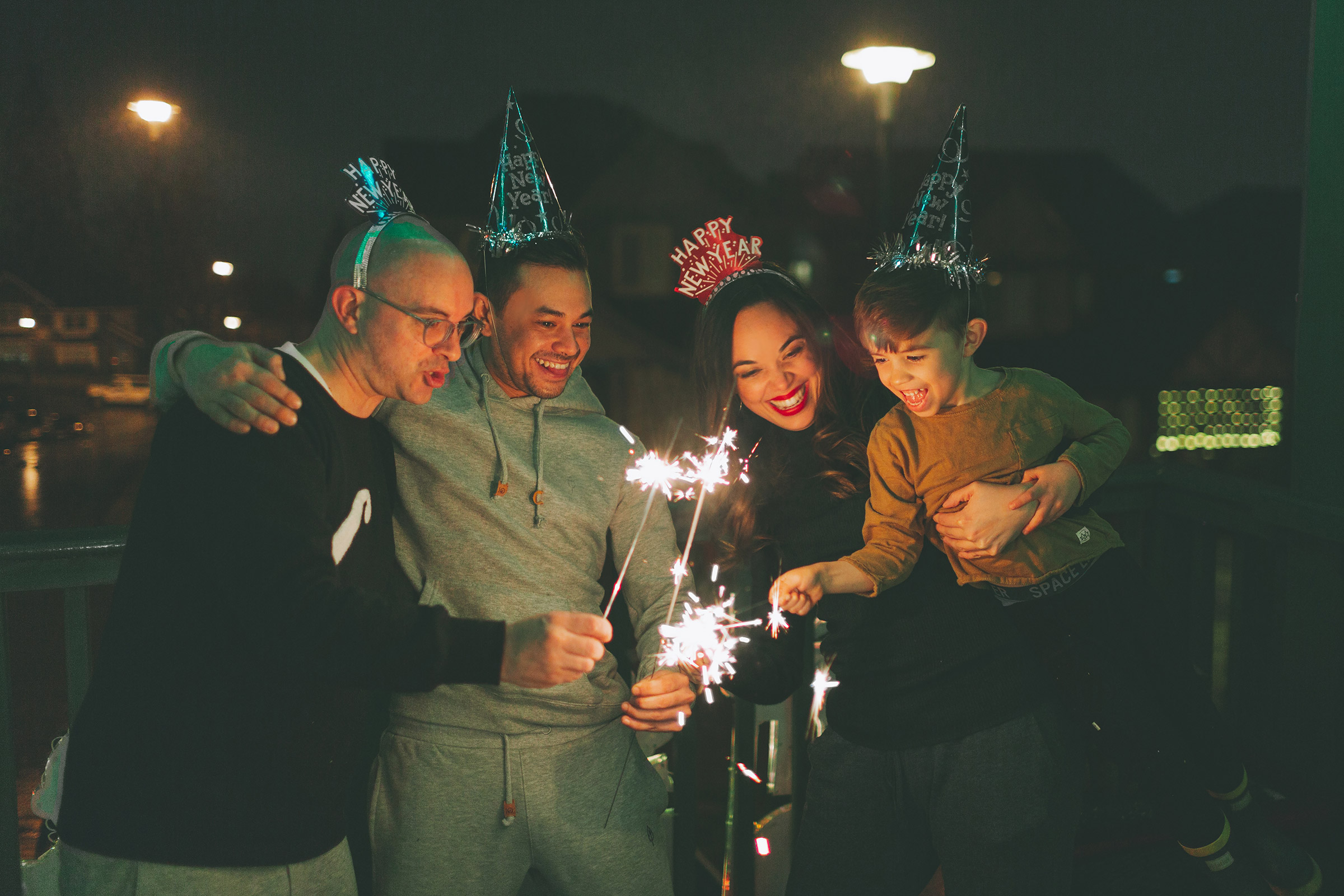 Family with sparklers celebrating New Years Eve