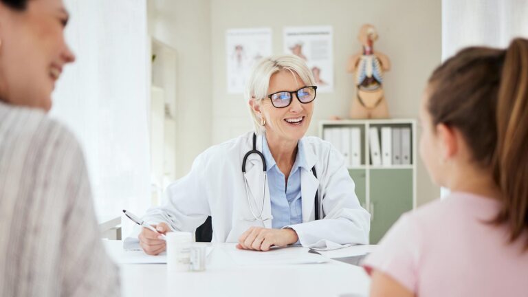 friendly female doctor with patients