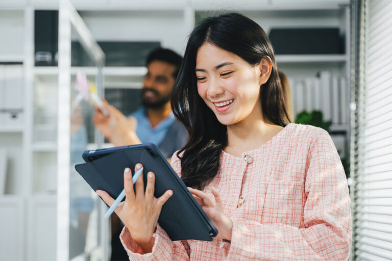 Happy young business people in modern office