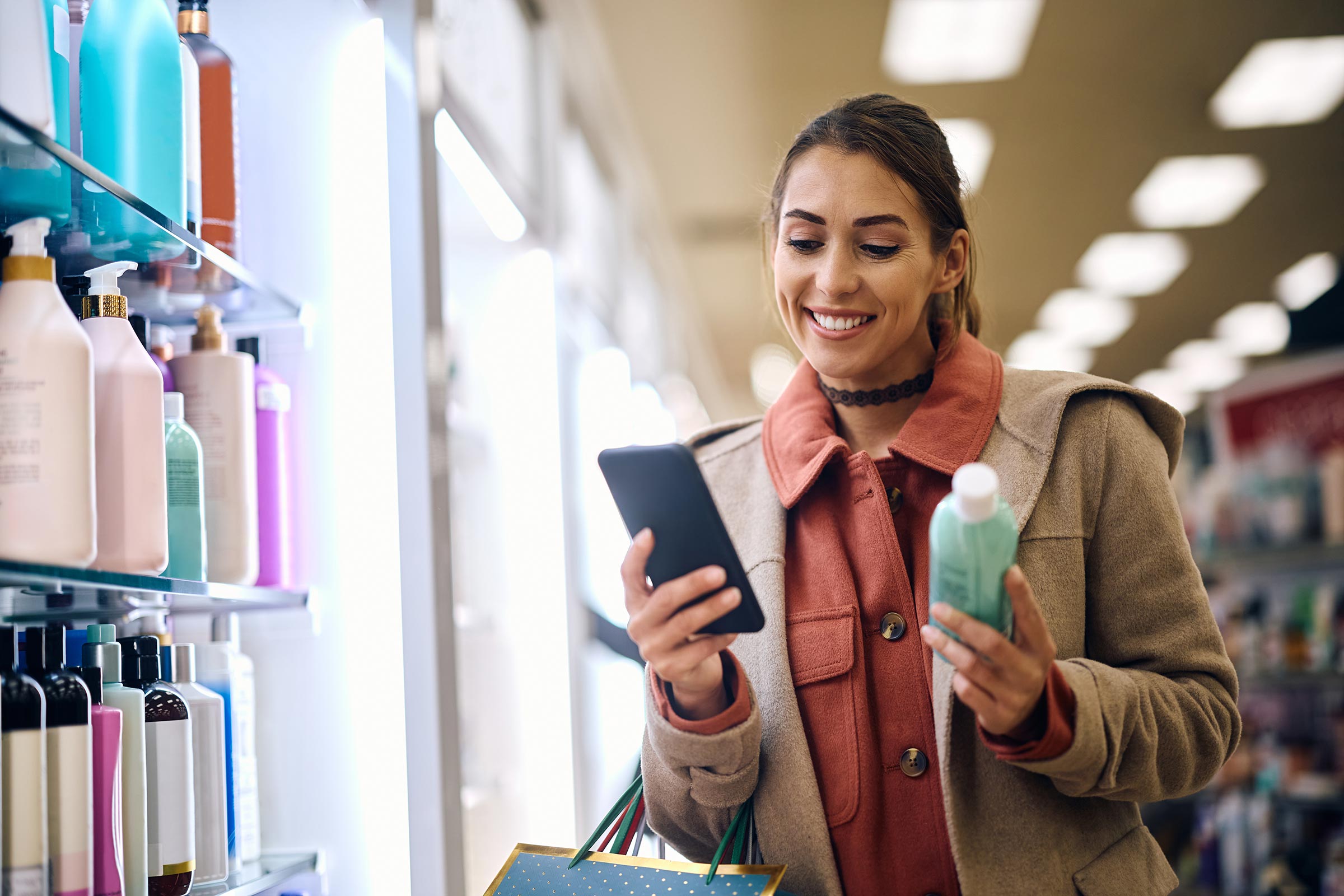 Happy woman buying skin care products
