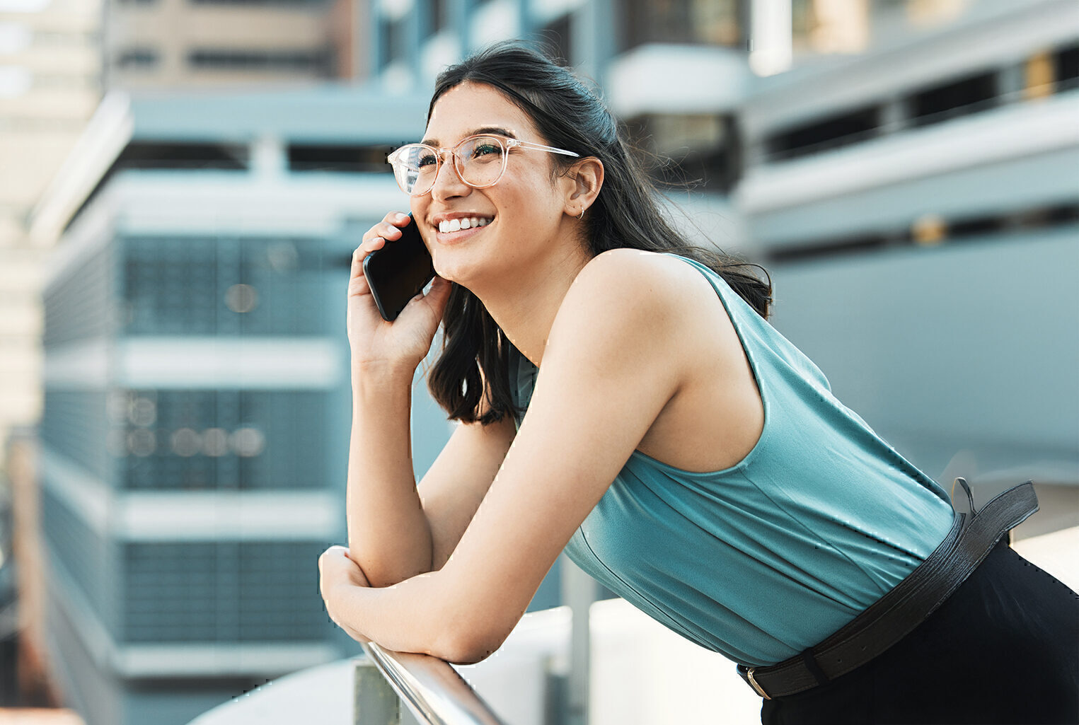 woman on phone outside of building