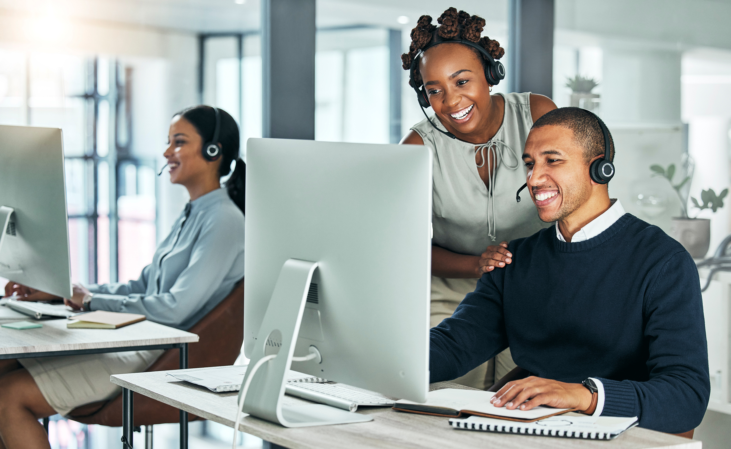 two black colleagues working together in office
