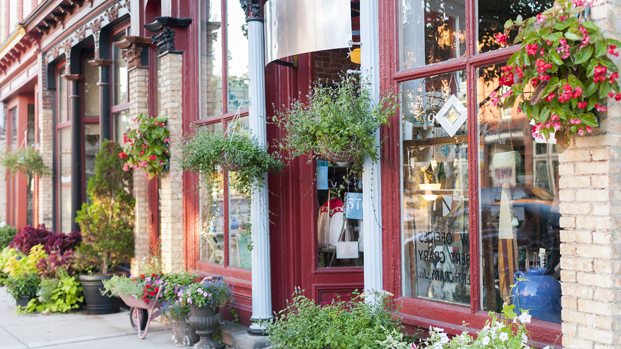 Neighborhood store with florals around the windows