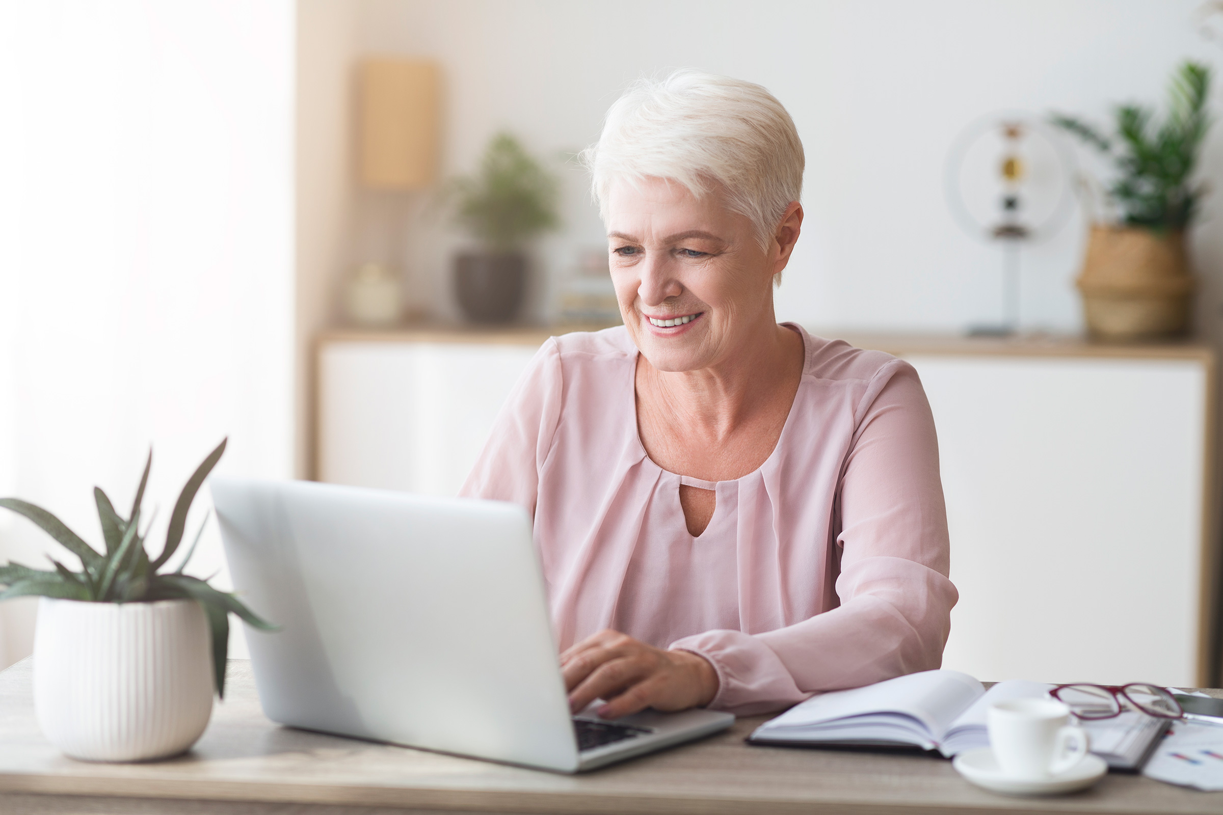 Mature woman checking billing statement online