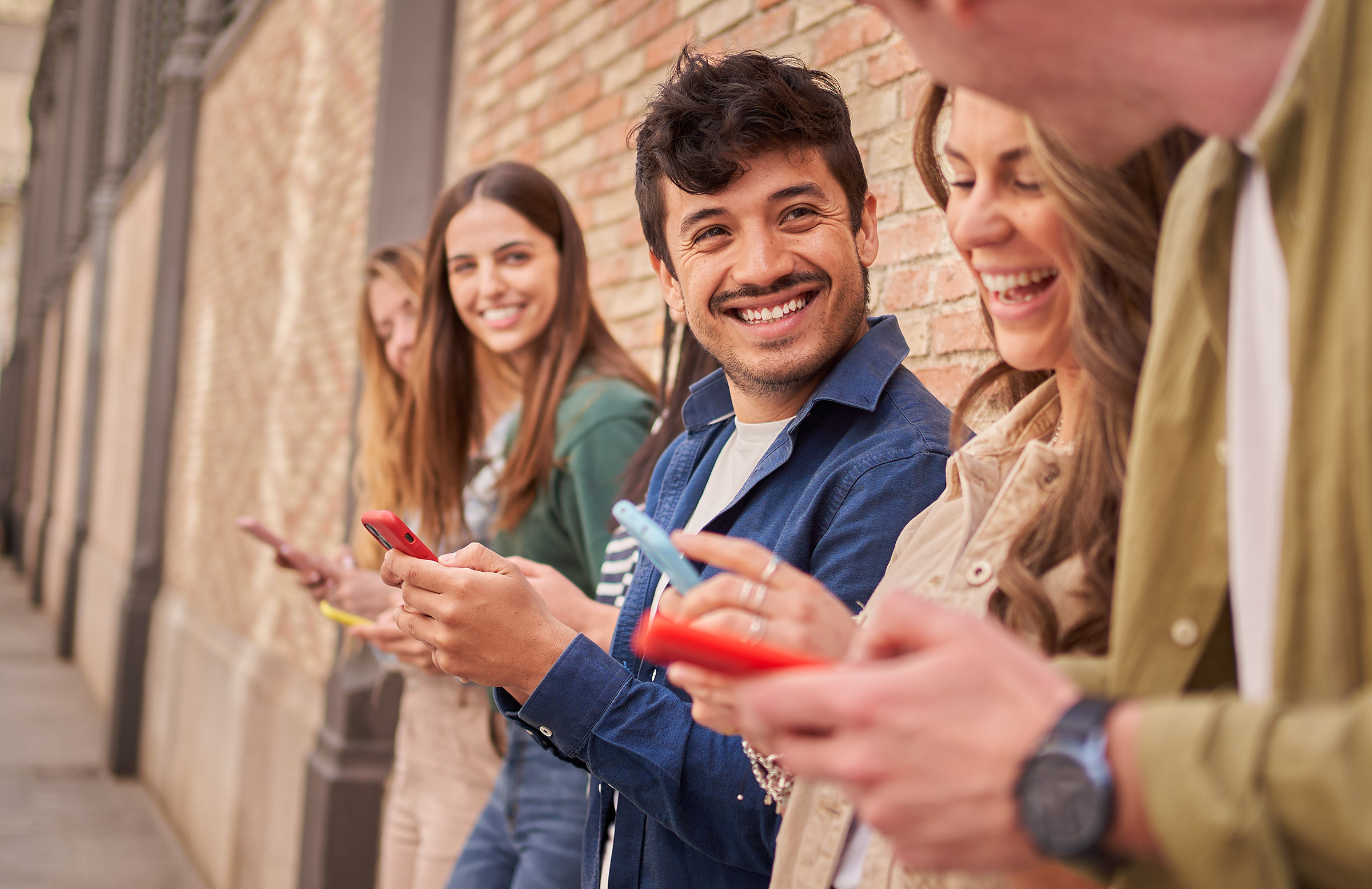 Group of multiracial young people with phones