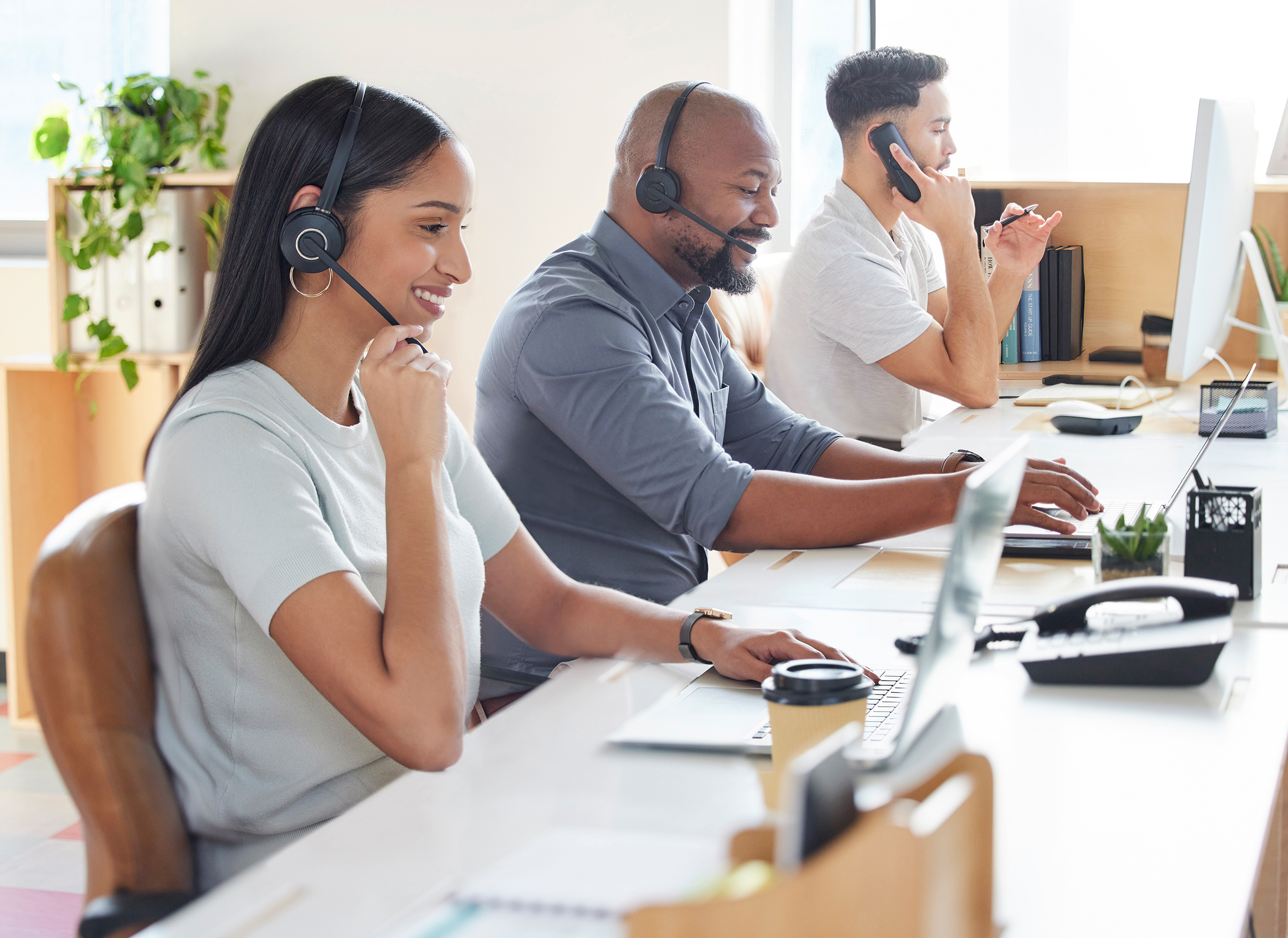 shot of a group of business people working in a call center