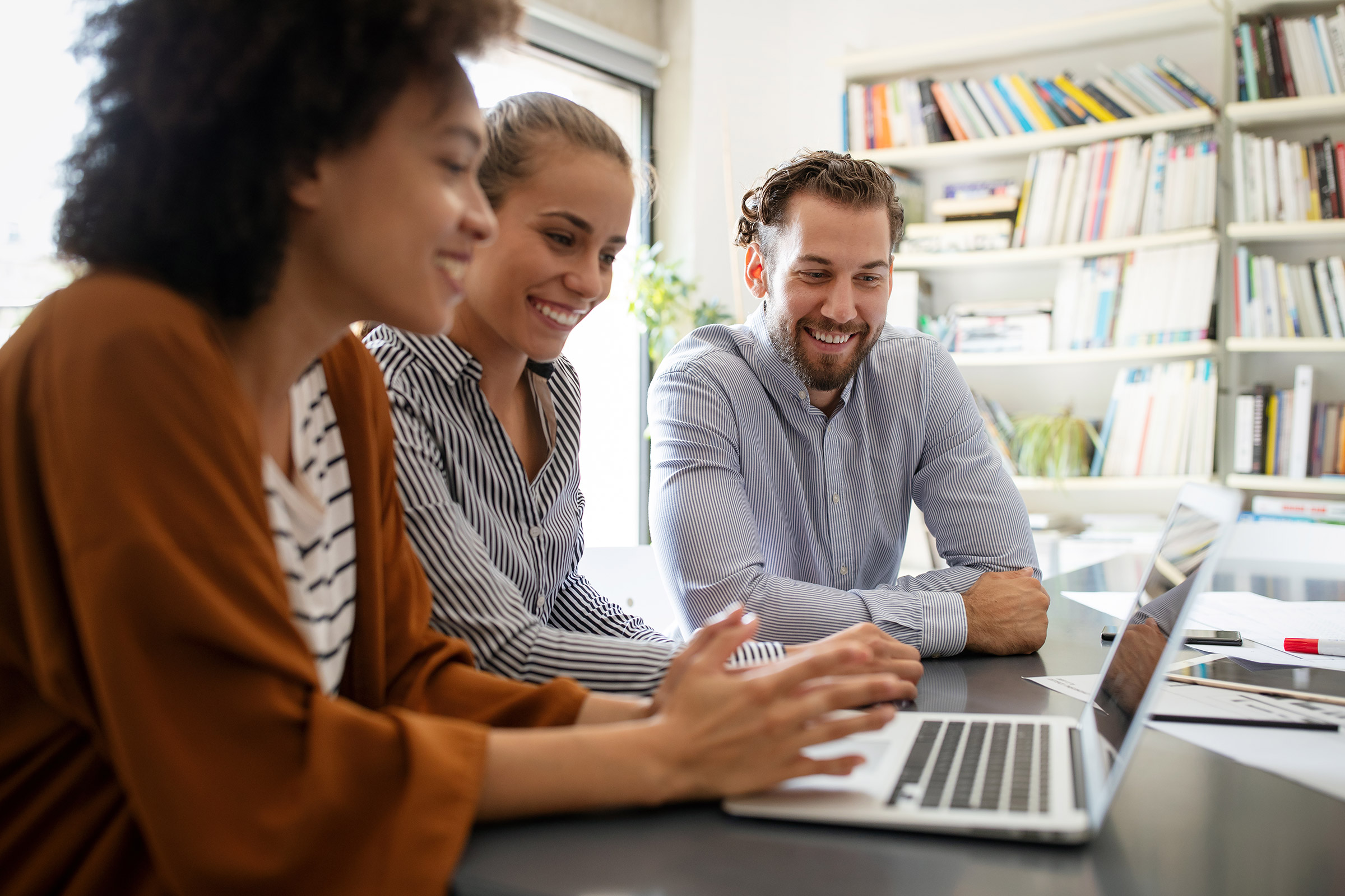 Group of workers collaborate at the office