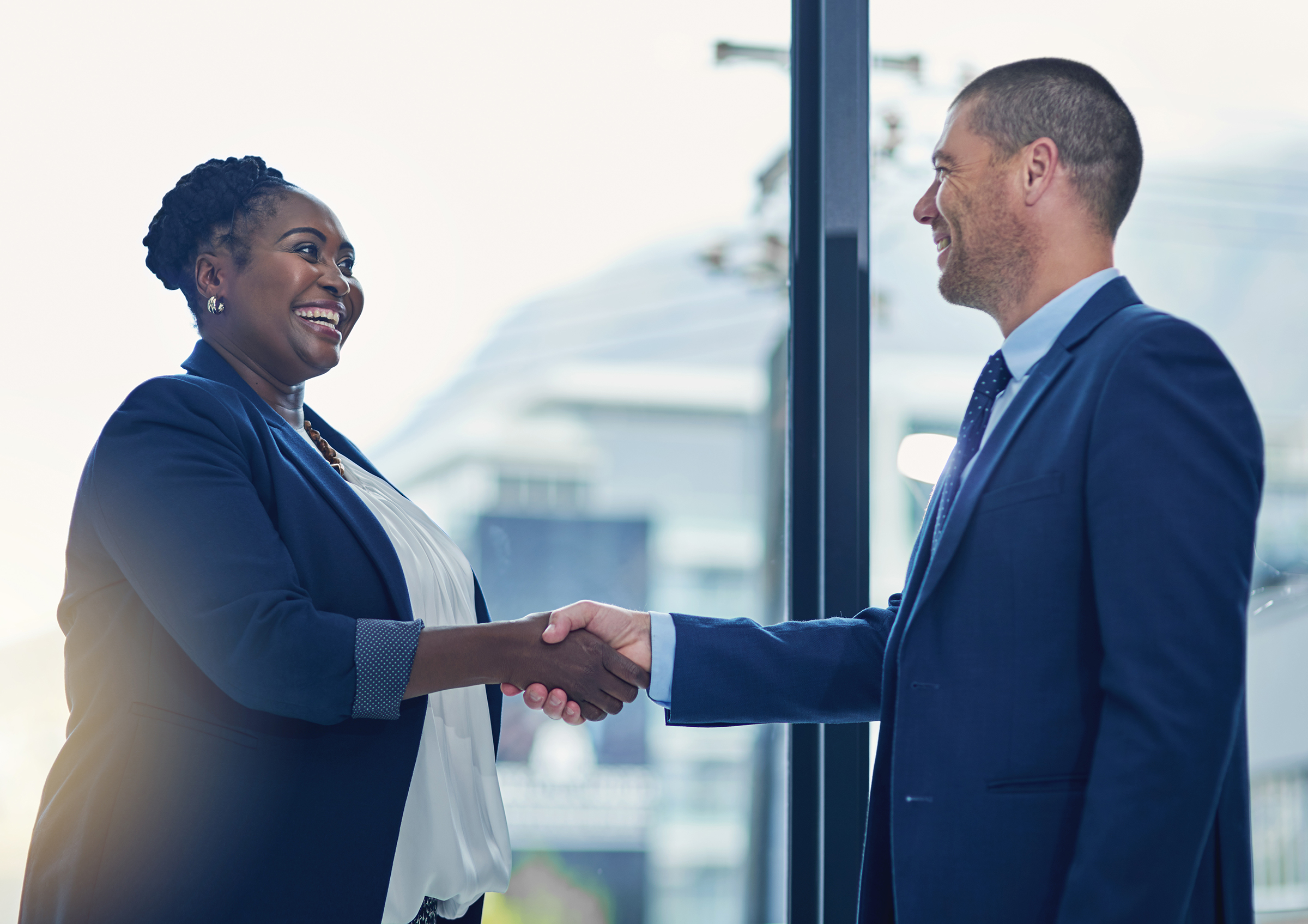 woman shakes hands with man
