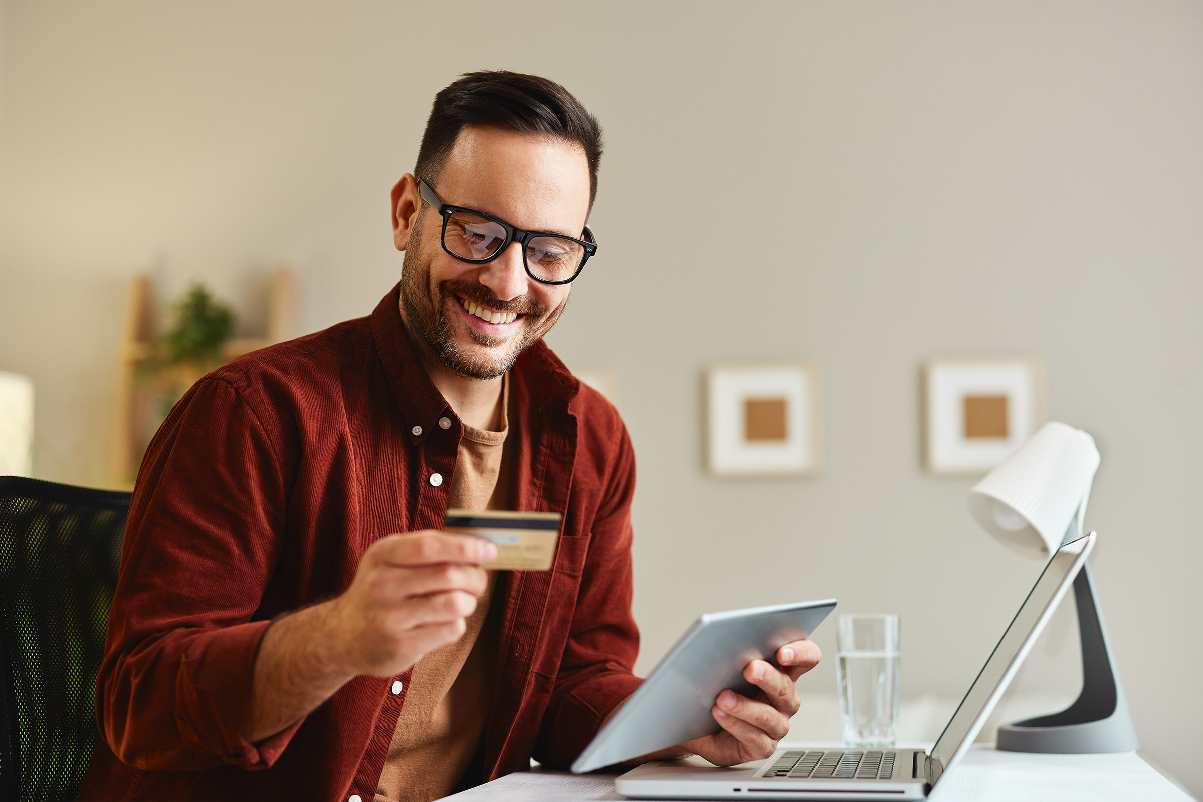 Man shops online using tablet