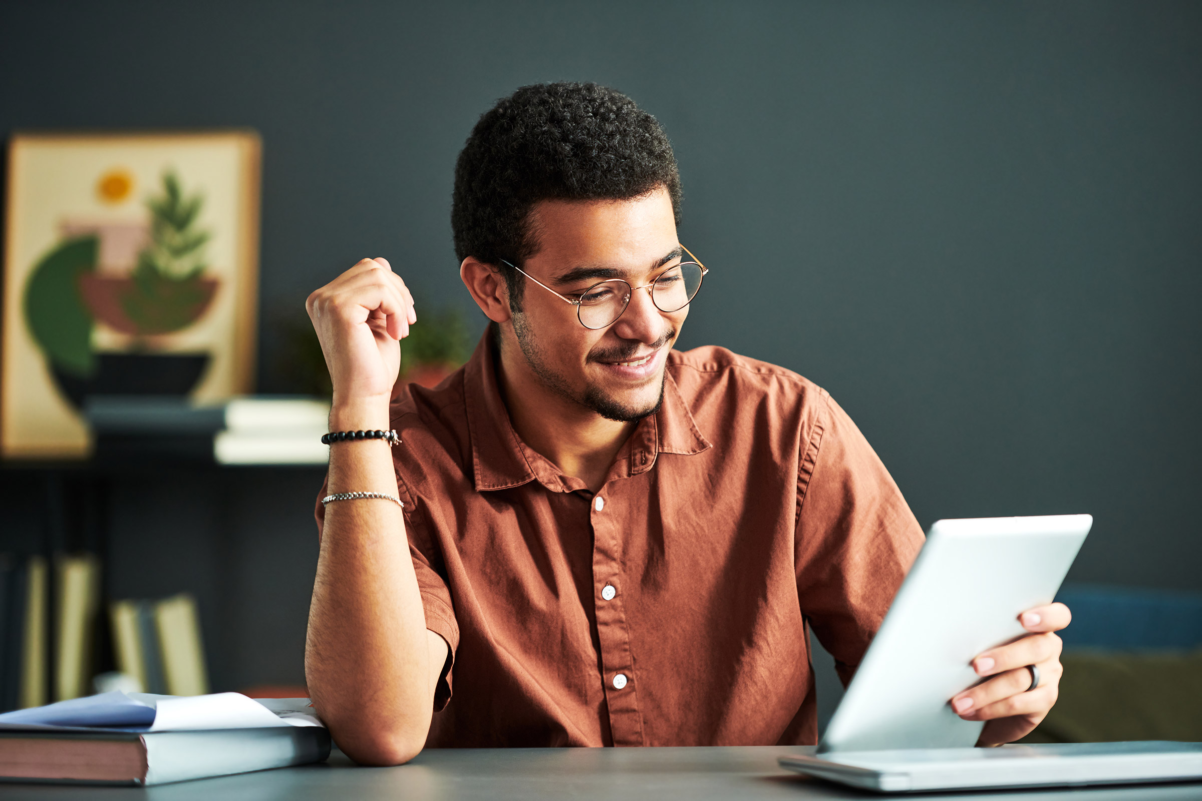 Young African American man uses tablet